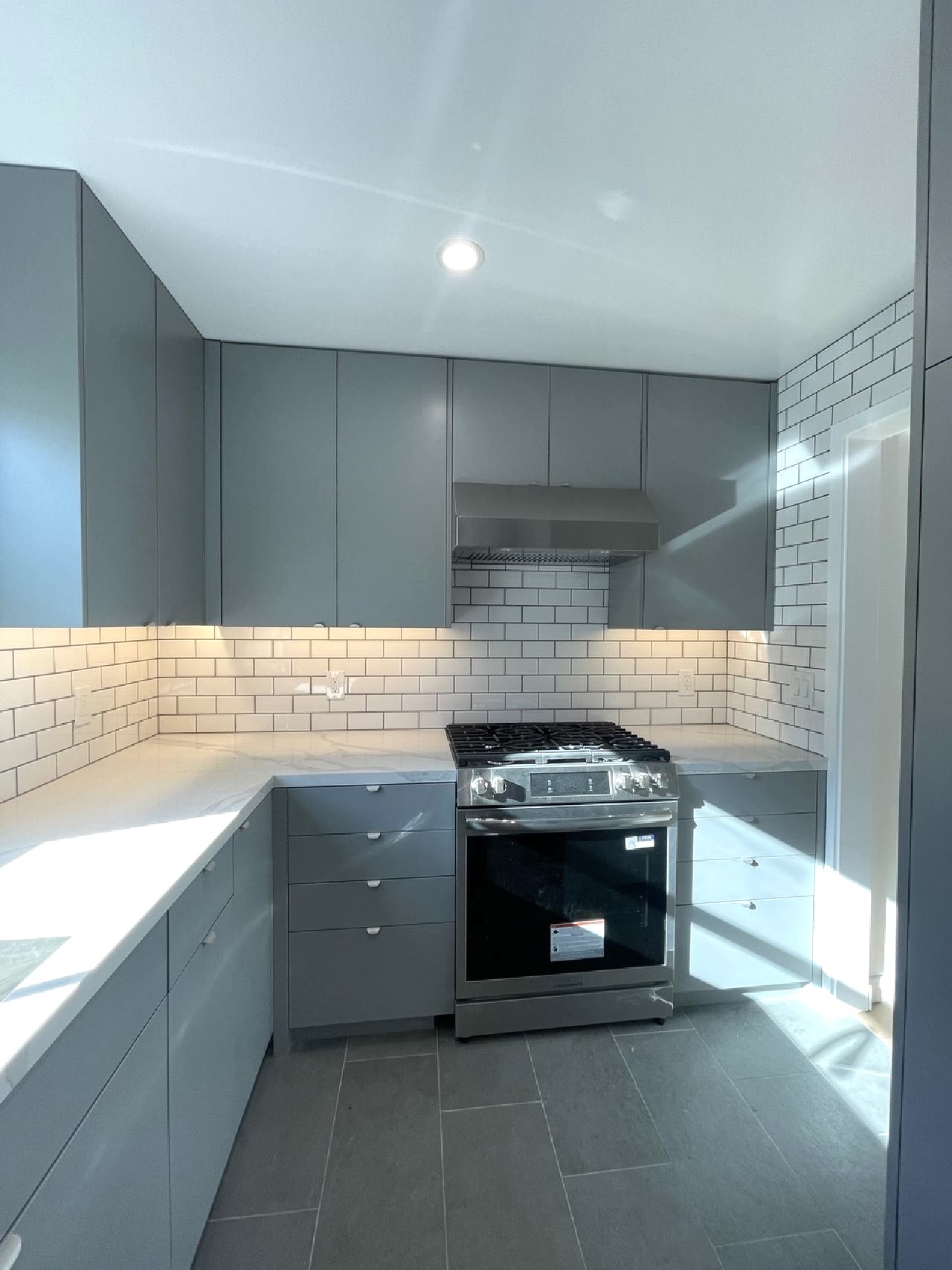 AJ Build — Modern exterior with metal railing and panel siding